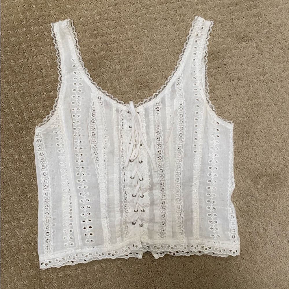 Sheer white corset top with lacy details